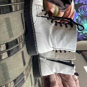Used white and black high top boots